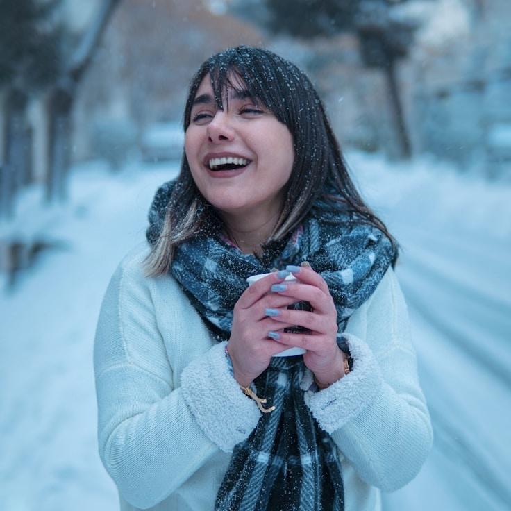 Ayla Sen, Lead Design Curator at Urban Matrix Flow, reviewing corporate floral arrangements